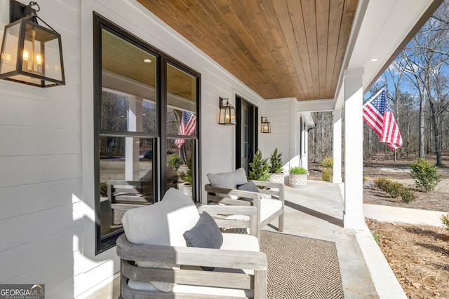 view of patio featuring a porch