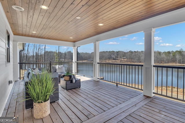 unfurnished sunroom with wooden ceiling and a water view