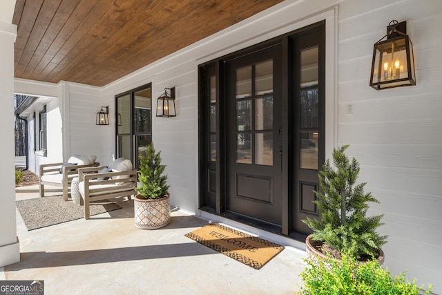 doorway to property with covered porch
