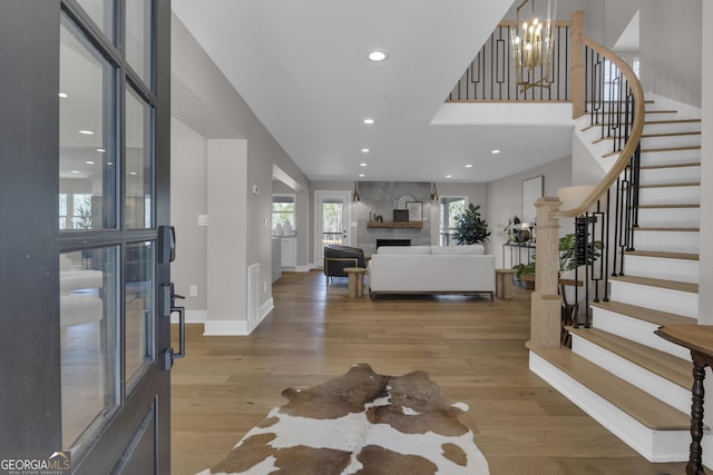 entryway featuring a fireplace and light wood-type flooring