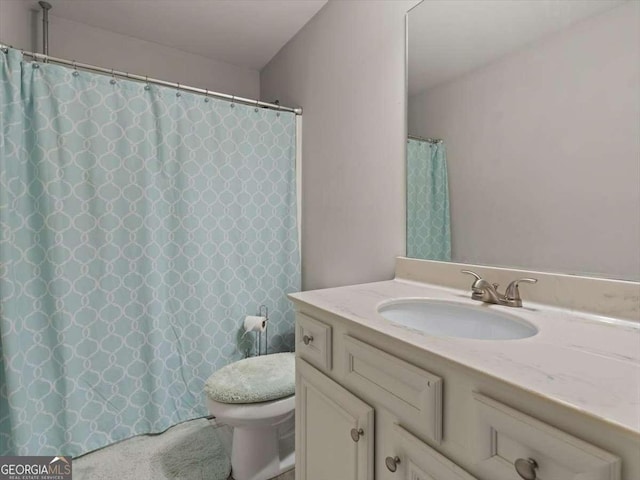 bathroom with vanity and toilet