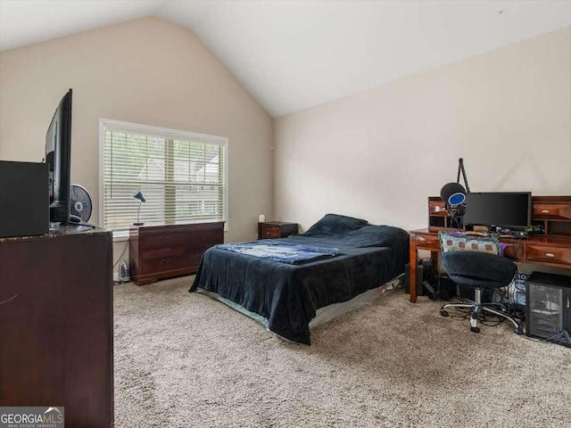 carpeted bedroom with lofted ceiling