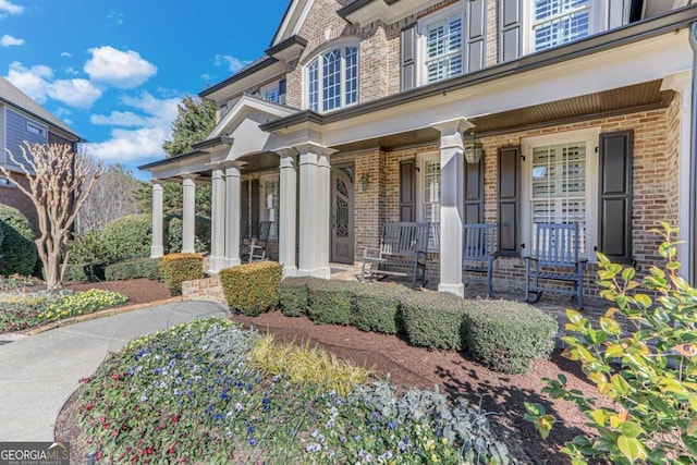 doorway to property featuring a porch