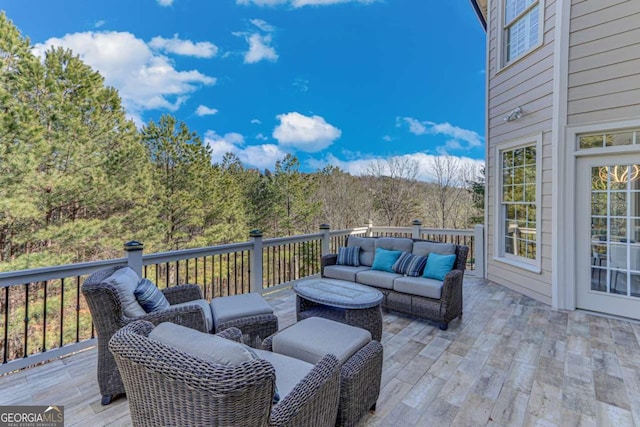 view of patio featuring an outdoor hangout area and a deck