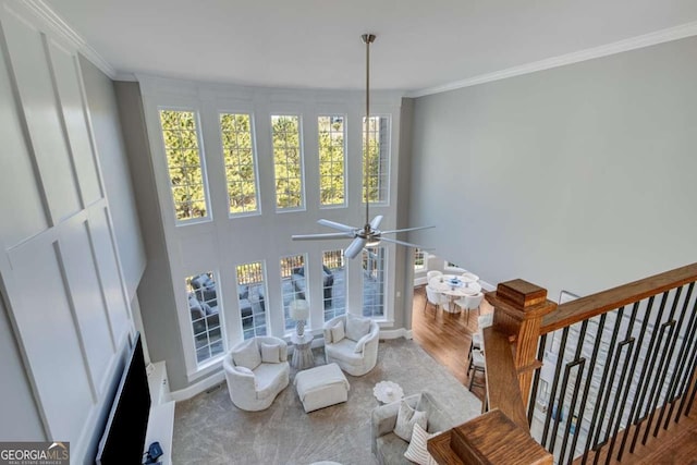 interior space with ornamental molding and hardwood / wood-style floors