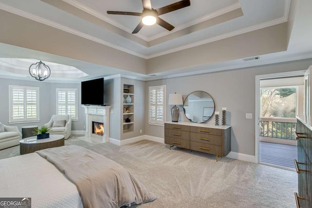 bedroom with light carpet, crown molding, access to outside, and a raised ceiling