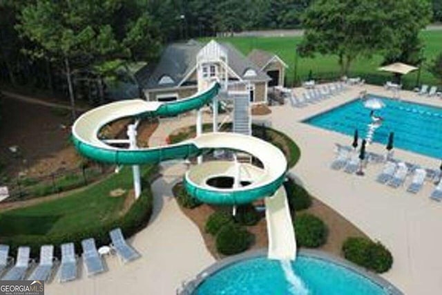 view of pool featuring a water slide