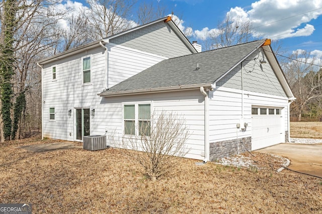 exterior space featuring a garage and central AC unit