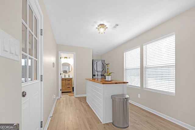 hall with light hardwood / wood-style floors