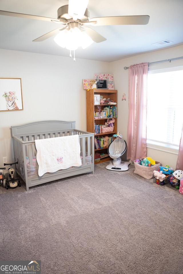 carpeted bedroom featuring ceiling fan