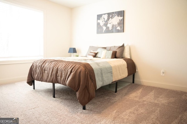 bedroom featuring carpet