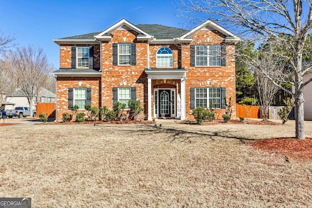 view of property featuring a front yard