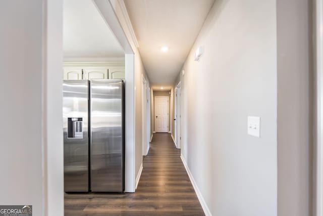 hallway with dark hardwood / wood-style flooring