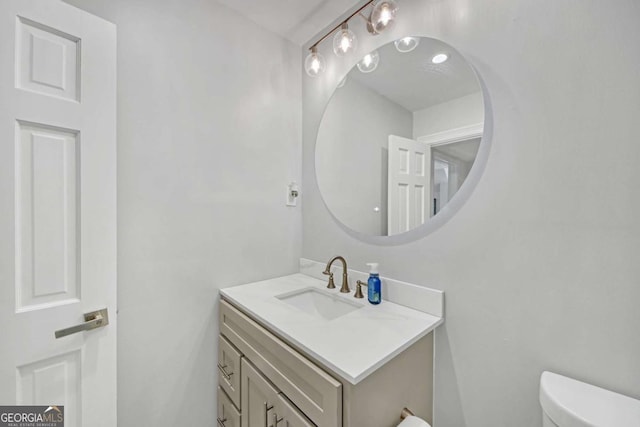 bathroom with vanity and toilet