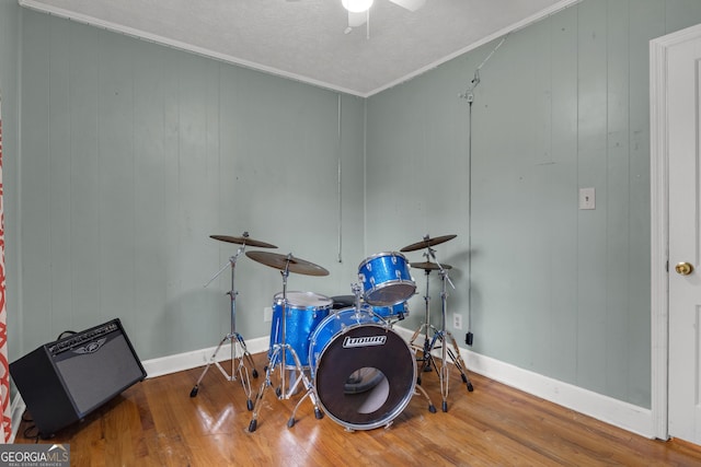 misc room featuring hardwood / wood-style flooring and crown molding