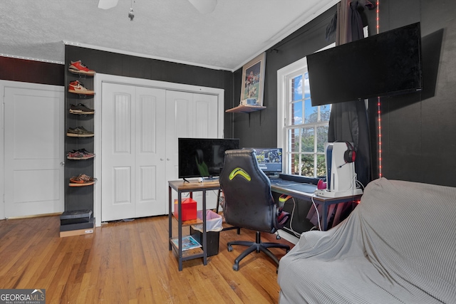 office space with wood-type flooring and ceiling fan