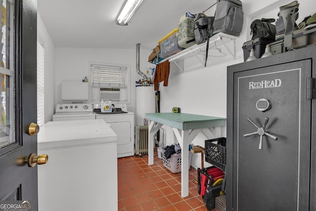 laundry room featuring tile patterned floors, gas water heater, washer and dryer, radiator heating unit, and cooling unit