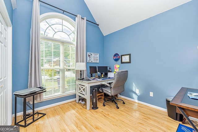 office area with hardwood / wood-style flooring and lofted ceiling