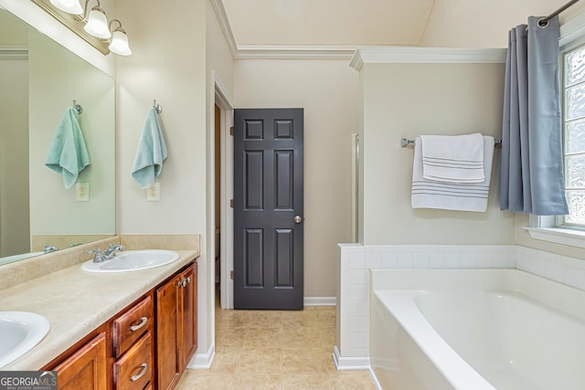 bathroom featuring tile patterned flooring, vanity, a bathtub, and ornamental molding