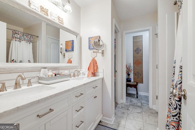 bathroom featuring vanity and tile patterned flooring