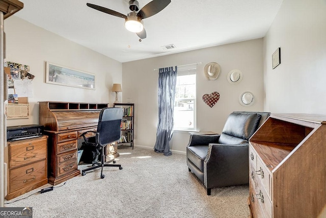 carpeted office featuring ceiling fan