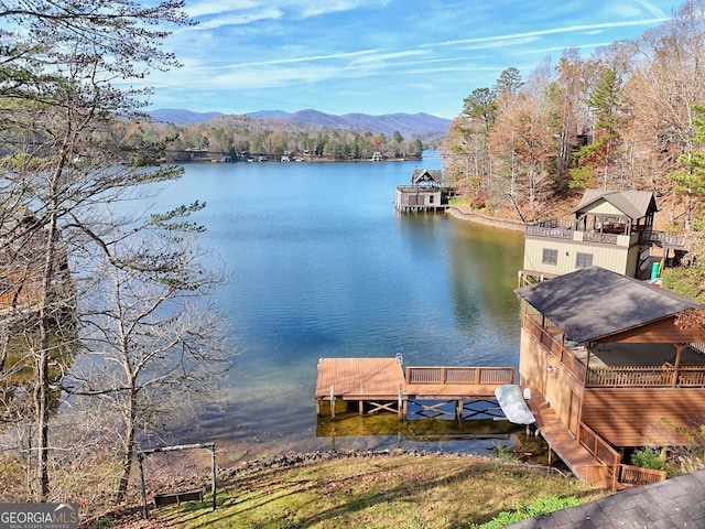 dock area featuring a water and mountain view