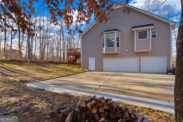 exterior space with a garage and a deck