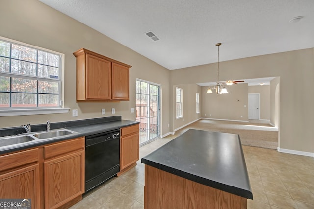 kitchen with sink, dishwasher, a kitchen island, a notable chandelier, and light tile patterned flooring