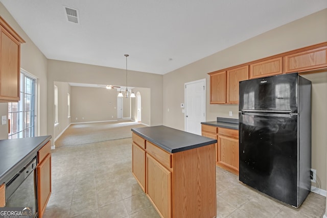 kitchen featuring hanging light fixtures, a kitchen island, black appliances, light tile patterned flooring, and ceiling fan with notable chandelier