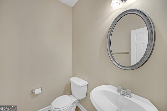 bathroom with toilet and sink