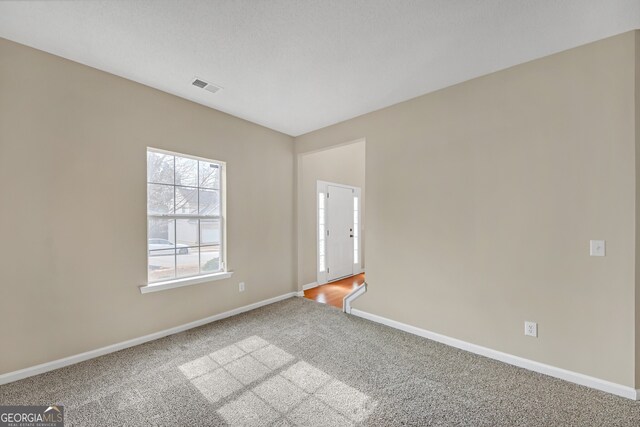 empty room with carpet floors