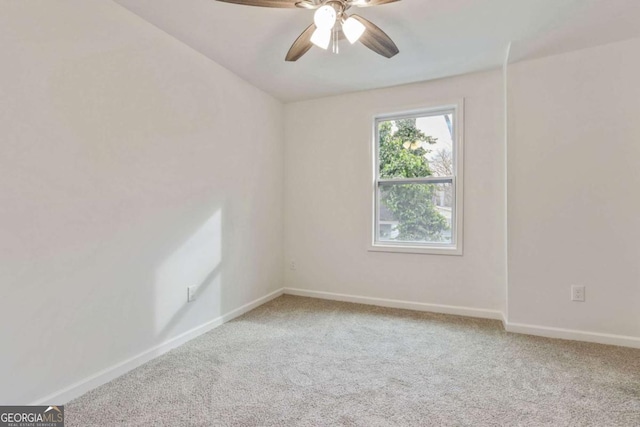 unfurnished room featuring carpet floors and ceiling fan