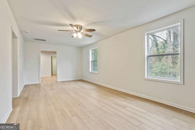 spare room with ceiling fan and light hardwood / wood-style floors