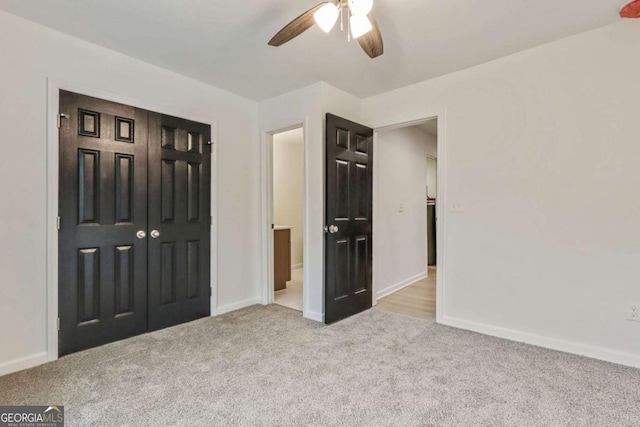 unfurnished bedroom with ceiling fan, light colored carpet, connected bathroom, and a closet