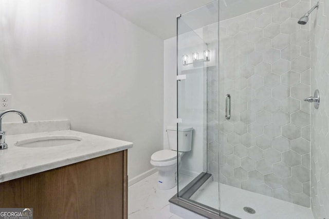 bathroom featuring vanity, toilet, and an enclosed shower