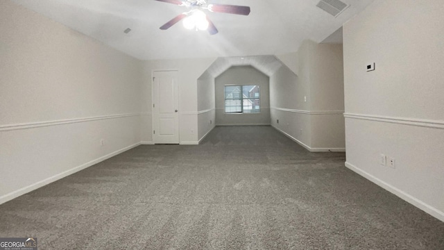 additional living space featuring dark carpet and ceiling fan