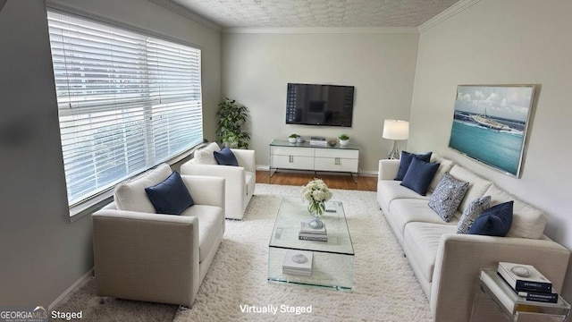 living room with ornamental molding and light wood-type flooring