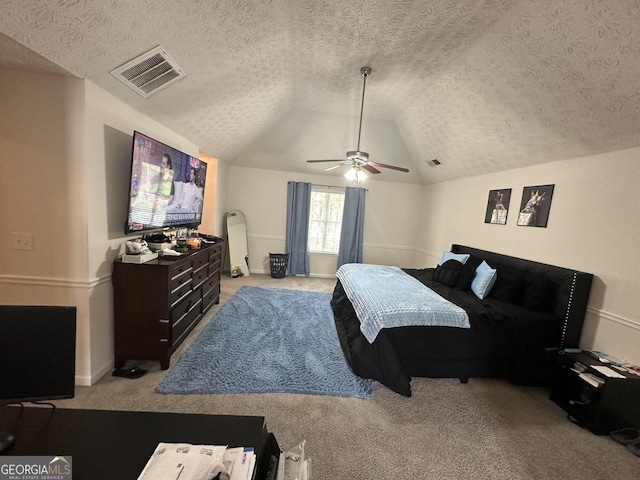 bedroom with ceiling fan, vaulted ceiling, light carpet, and a textured ceiling