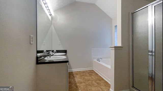 bathroom with vanity, lofted ceiling, and plus walk in shower