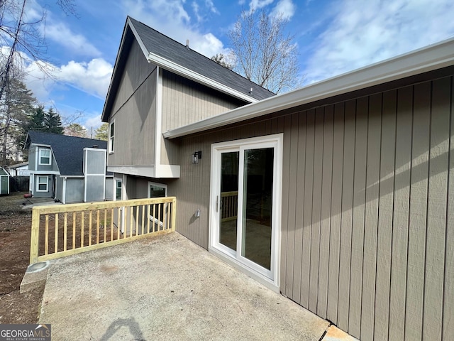 view of side of property featuring a patio