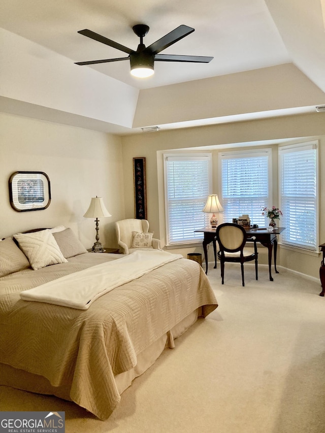 carpeted bedroom with lofted ceiling and ceiling fan