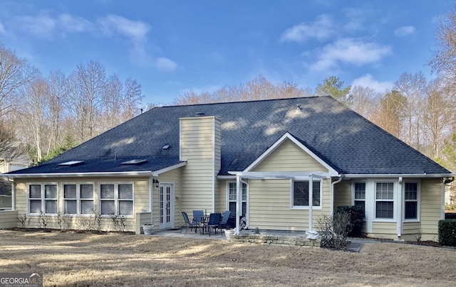 back of property featuring a patio