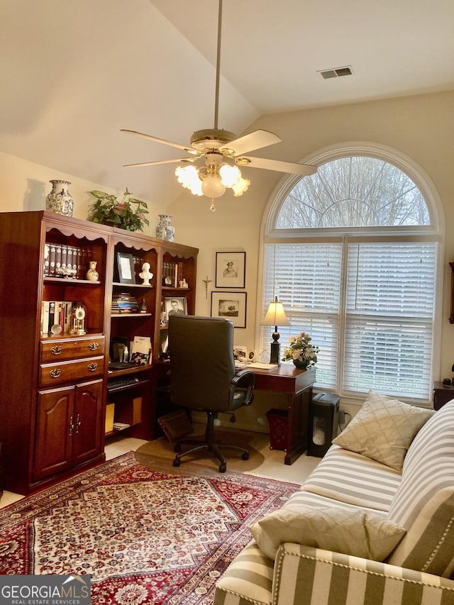 home office with ceiling fan and vaulted ceiling