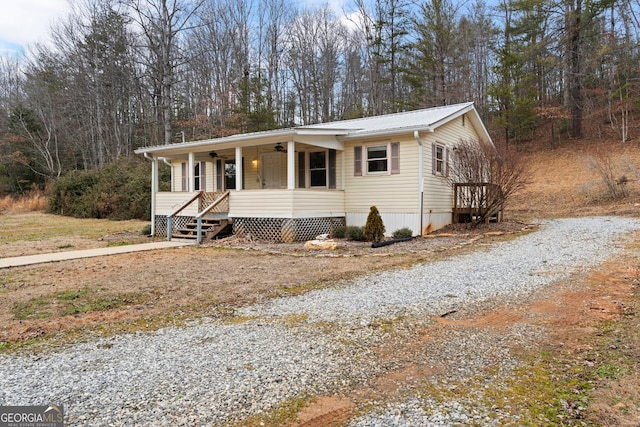 view of front of home with ceiling fan and covered porch