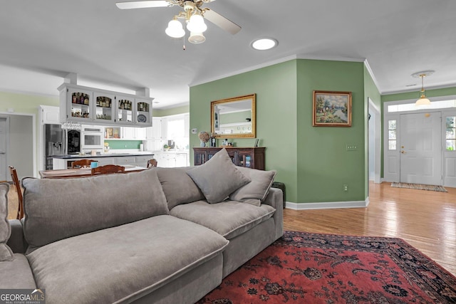 64 Lake No No Rd, Midway, GA 31320 - living room featuring crown molding, ceiling fan, and light hardwood / wood-style flooring