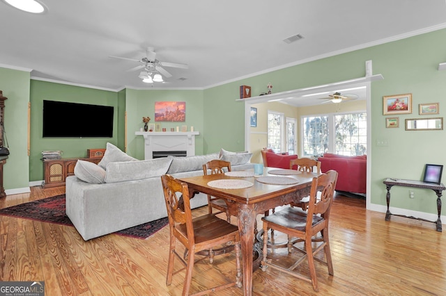 64 Lake No No Rd, Midway, GA 31320 - dining area with ornamental molding, ceiling fan, and light hardwood / wood-style floors