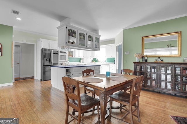 64 Lake No No Rd, Midway, GA 31320 - dining area with light wood-type flooring, ornamental molding, and recessed lighting