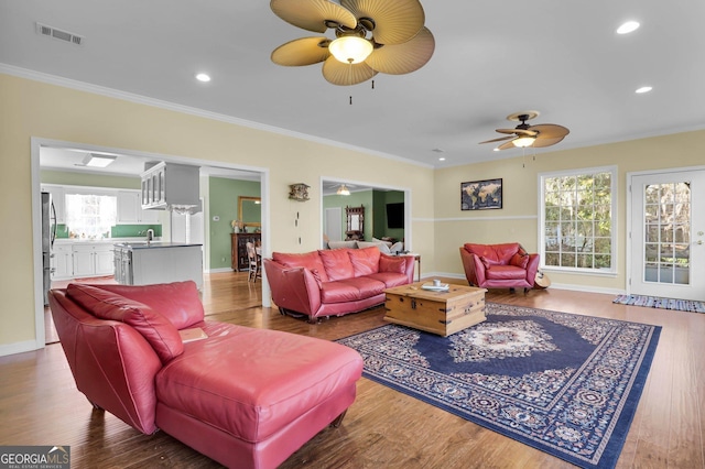 64 Lake No No Rd, Midway, GA 31320 - living room with crown molding, hardwood / wood-style floors, and ceiling fan