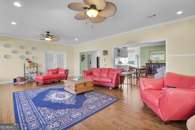64 Lake No No Rd, Midway, GA 31320 - living room with crown molding, hardwood / wood-style floors, ceiling fan, and french doors