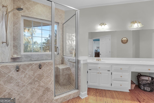 64 Lake No No Rd, Midway, GA 31320 - bathroom featuring vanity, wood-type flooring, crown molding, and a shower with shower door